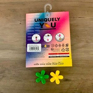 2 Crocs flower jibbitz yellow and green